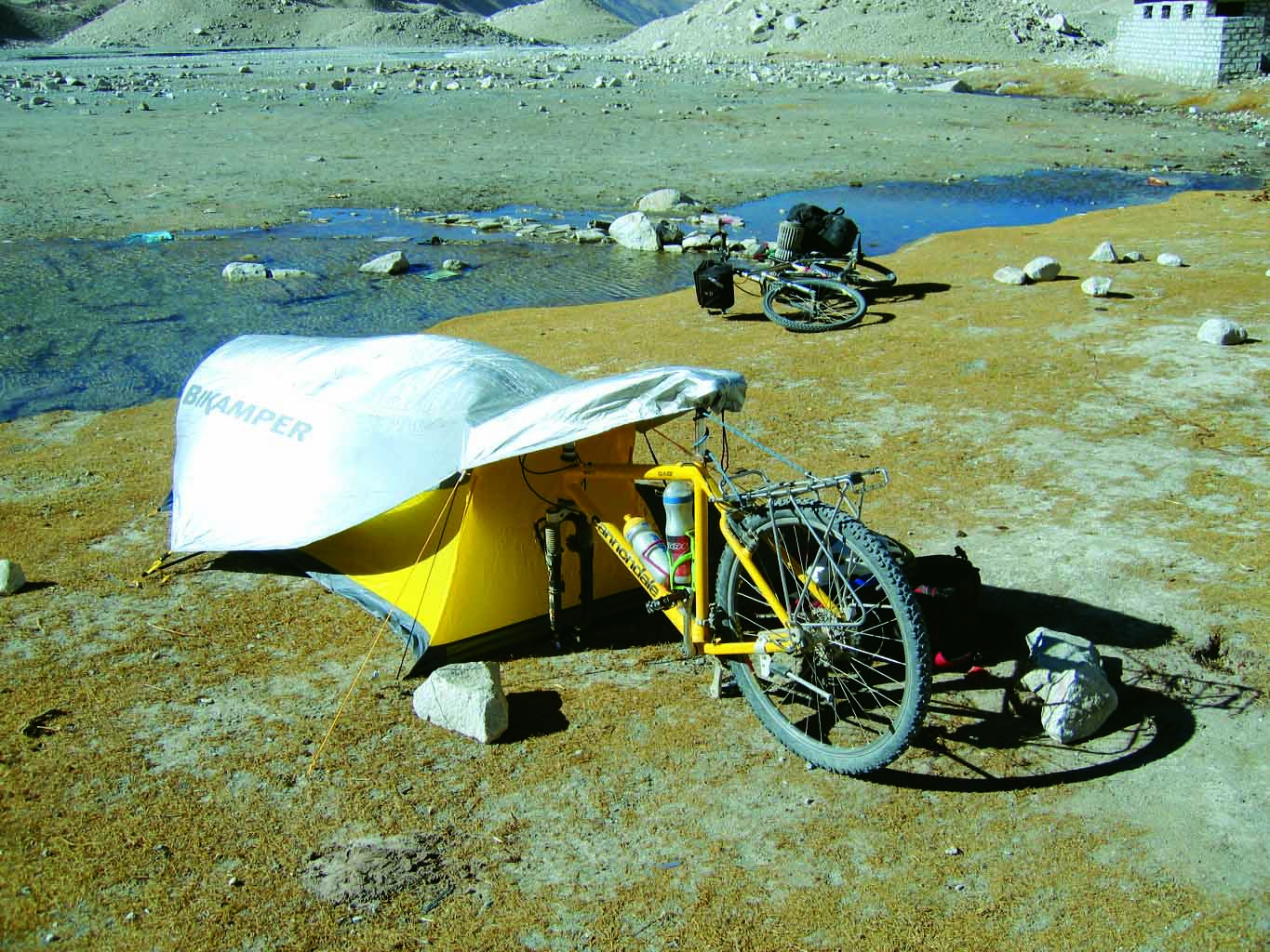 Topeak's camping solution makes the bike part of the tent. Topeak's camping solution makes the bike part of the tent.