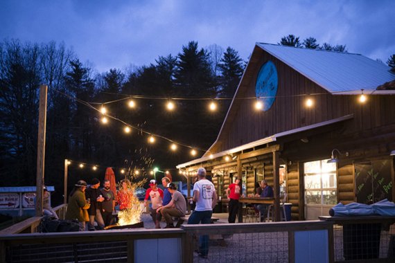 The Hub & Pisgah Tavern in North Caroline attracts the community with an outdoor bar with fire pit. The Hub & Pisgah Tavern in North Caroline attracts the community with an outdoor bar with fire pit.