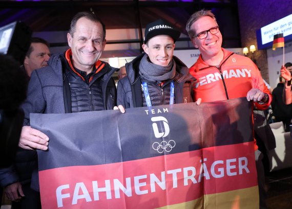 DOSB President Alfons Hörmann, flag bearer Eric Frenzel and the German Chief of Mission Dirk Schimmelpfennig at the opening of the Deutsches Haus DOSB President Alfons Hörmann, flag bearer Eric Frenzel and the German Chief of Mission Dirk Schimmelpfennig at the opening of the Deutsches Haus