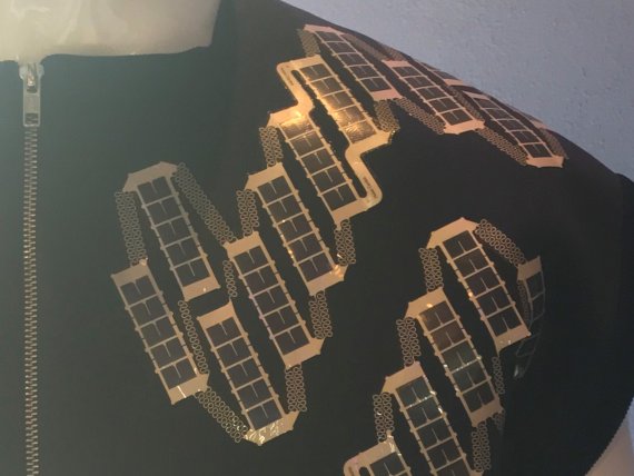 A solar shirt which can charge a smart phone. A solar shirt which can charge a smart phone.