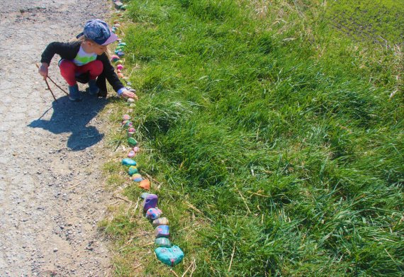 Colourful stone snakes are often found close to day-care centres and primary schools.