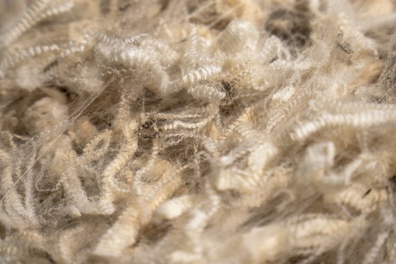 A pile of beige new wool