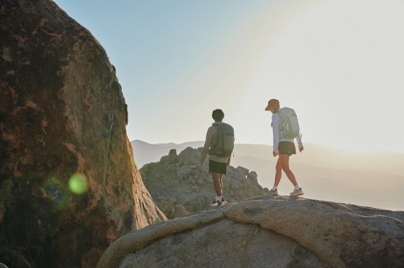 Woman and man hiking on a mountain