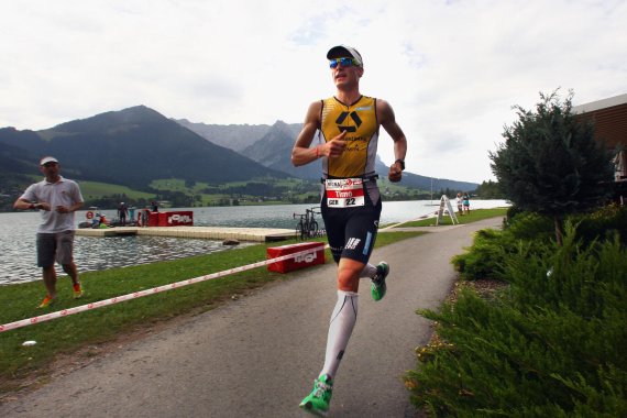 Triathlete with Walchsee in the background.