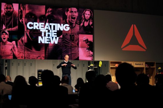 Matt O'Toole in front of an audience at a conference 