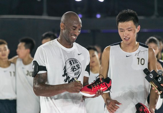 mb-160708-4-original Kobe Bryant signs his fans’ sneakers in the House of Mamba in Shanghai.