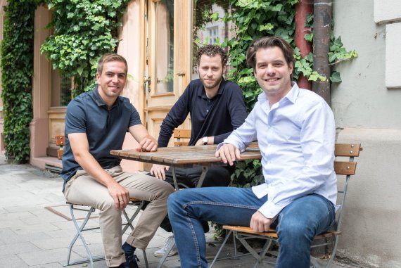Philipp Lahm with the Fanmiles founders, Fabian Schmidt and Alan Sternberg, in Isarvorstadt, Munich. The trio appeared together on the big stage at Bits & Pretzels 2017.