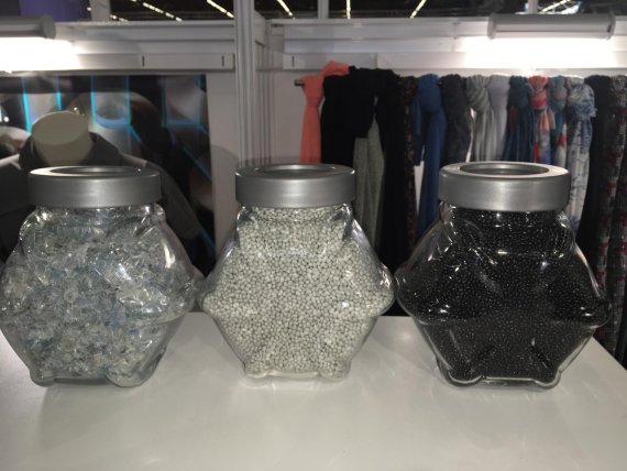 From left to right recovered plastic garbage from teh ocean floor is crushed into flakes, melted into pellets for extrusion or dye added for permanent color prior to extrusion of yarn