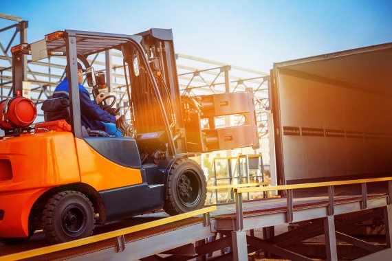 Transport of goods Man in forklift transporting goods