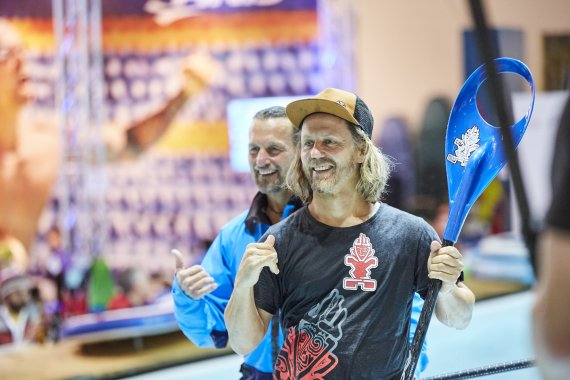 Fun at the Water Sports Village. Man with paddle in his hand at the ISPO Pool.