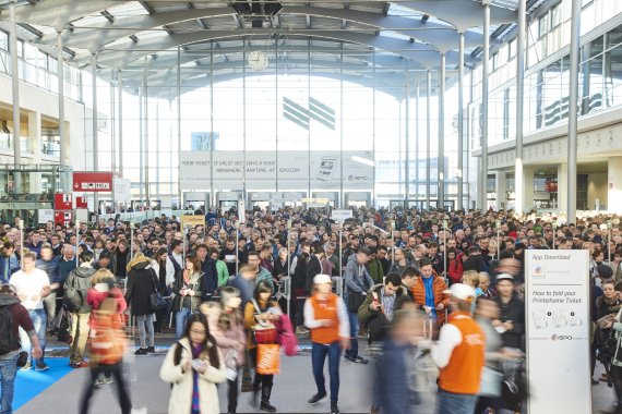 Visitor rush at the West Entrance of ISPO Munich. Attendance at the entrance to the Munich Trade Fair Centre.