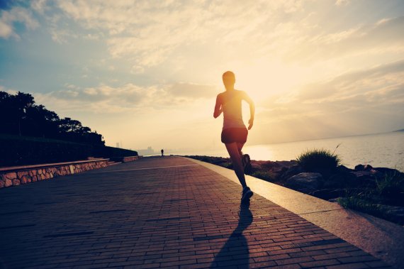 Running woman on the shore
