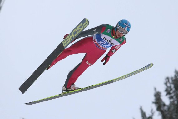 Ski jumper up in the air at the Four Hills Tournament