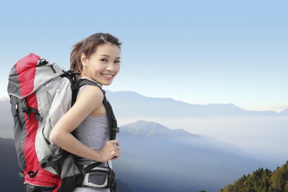 mb-Sanfo_Hiking Woman with a big backpack on a mountain.