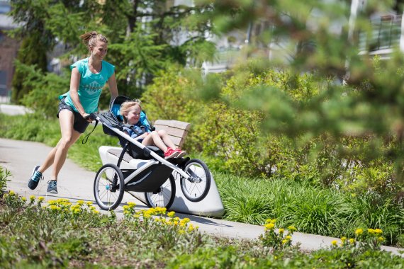 On the move: Ingalena Schömburg-Heuck running with her niece, Matilda, in a stroller.