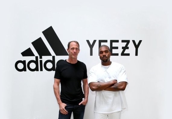 Member of the Executive Board of adidas Eric Liedtke (l.) and superstar Kanye West presenting the new project