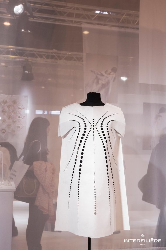 Laser cut paper dress.