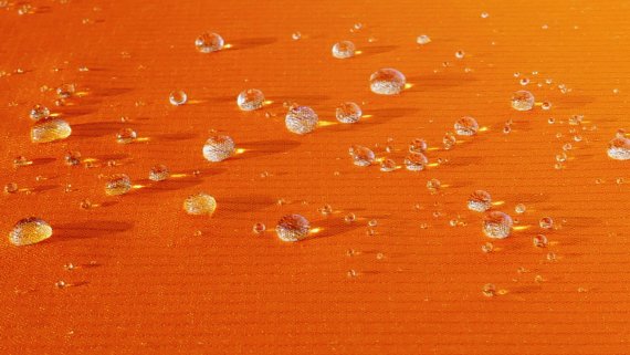 mb-170202-entrant orange fabric with walter drops P1010317 (2) ENTRANT® WEAR is meant to prevent water from seeping in, but to wick moisture away from the inside out.