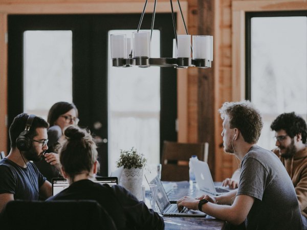 People sit at the table and work