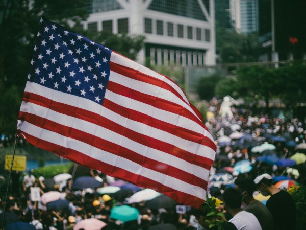 US flag over crowd