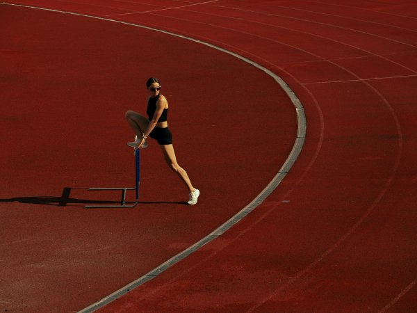 Athlete stretches on the sports field