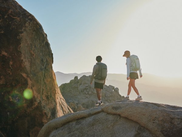 Woman and man hiking on a mountain