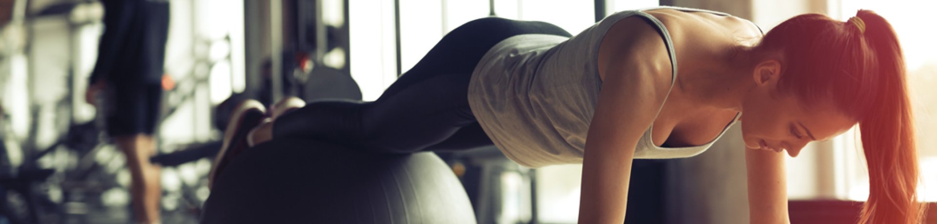 Woman exercising with gym ball