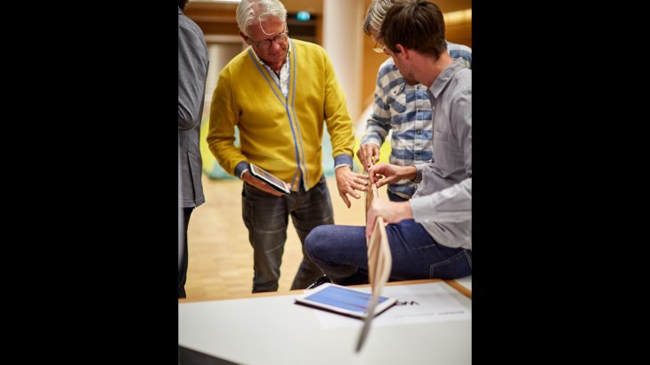 The jury members check the quality and design of the products. The jury members check the quality and design of the products.