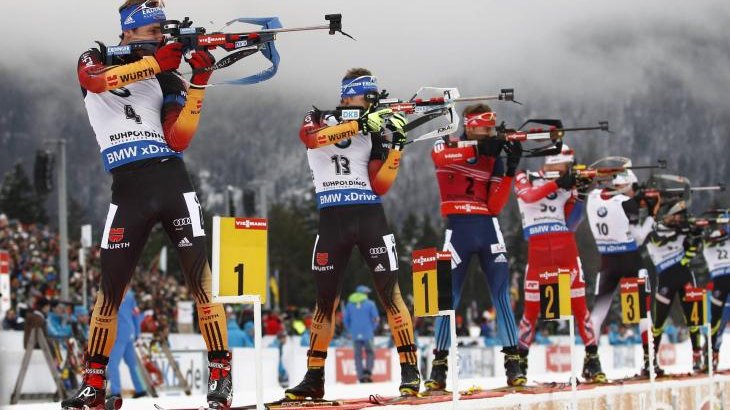 Source: Imago/GEPA Pictures Biathletes stand in line and shoot.