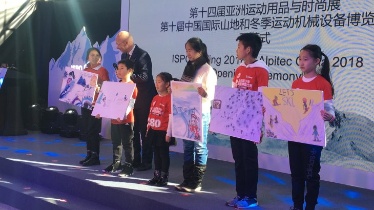 Young wintersport students of the Beijing Magic School are interviewed by Klaus Dittrich during the Opening Ceremony der ISPO Beijing 2018