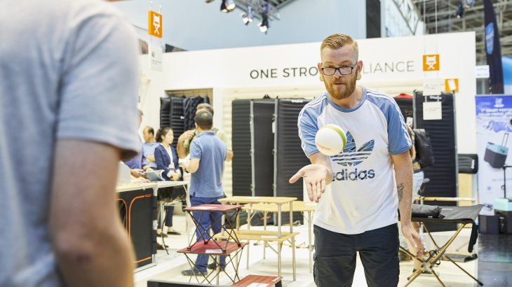 People trying ou table tennis at OutDoor by ISPO 2019.