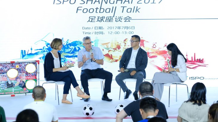 Adjacent to the water sports demo hall, Wynton Rufer (second from the right) explains the development of soccer in China to the audience