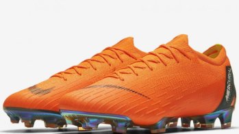 Orange football boot by Nike.