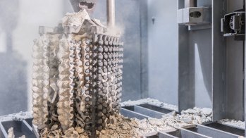 Parts being removed from the cast by vibration