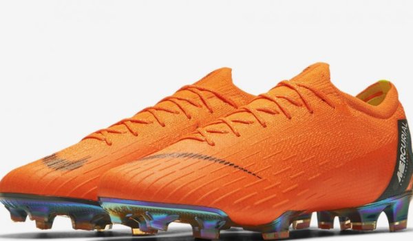 Orange football boot by Nike.