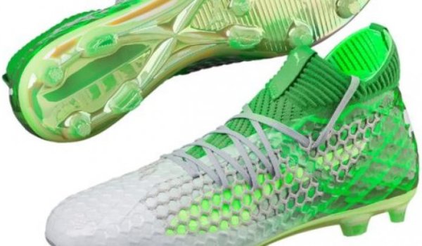 Green football shoes by Puma. 