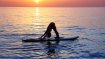 SUP-Yoga promotes concentration and balance, since the exercises are carried out on the water on a surfboard.