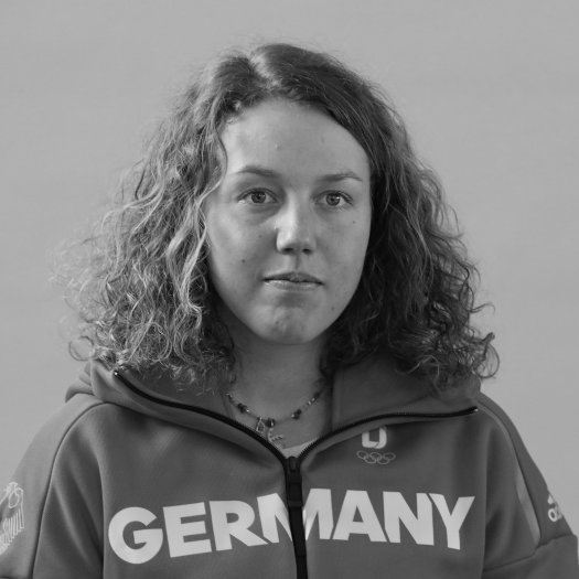 Black-and-white portrait of biathlete Laura Dahlmeier at the Olympic fitting in Munich 2018