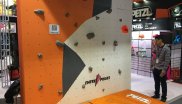 Hands on testing beats theory: That’s why exhibitor Petzl built a boulder wall at its booth.