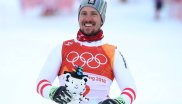 The Austrian Marcel Hirscher is pleased about his very first Olympic gold medal in the super combination. Soohorang celebrates with him.