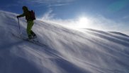 Karl with the jacket in rough conditions on the way to the mountain peak, where about 60 km/h strong wind blew hard snow into his face.