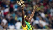 In goldenen Puma-Schuhen siegt Usain Bolt über 100 Meter – und setzt seinen Ausrüster anschließend gut in Szene.