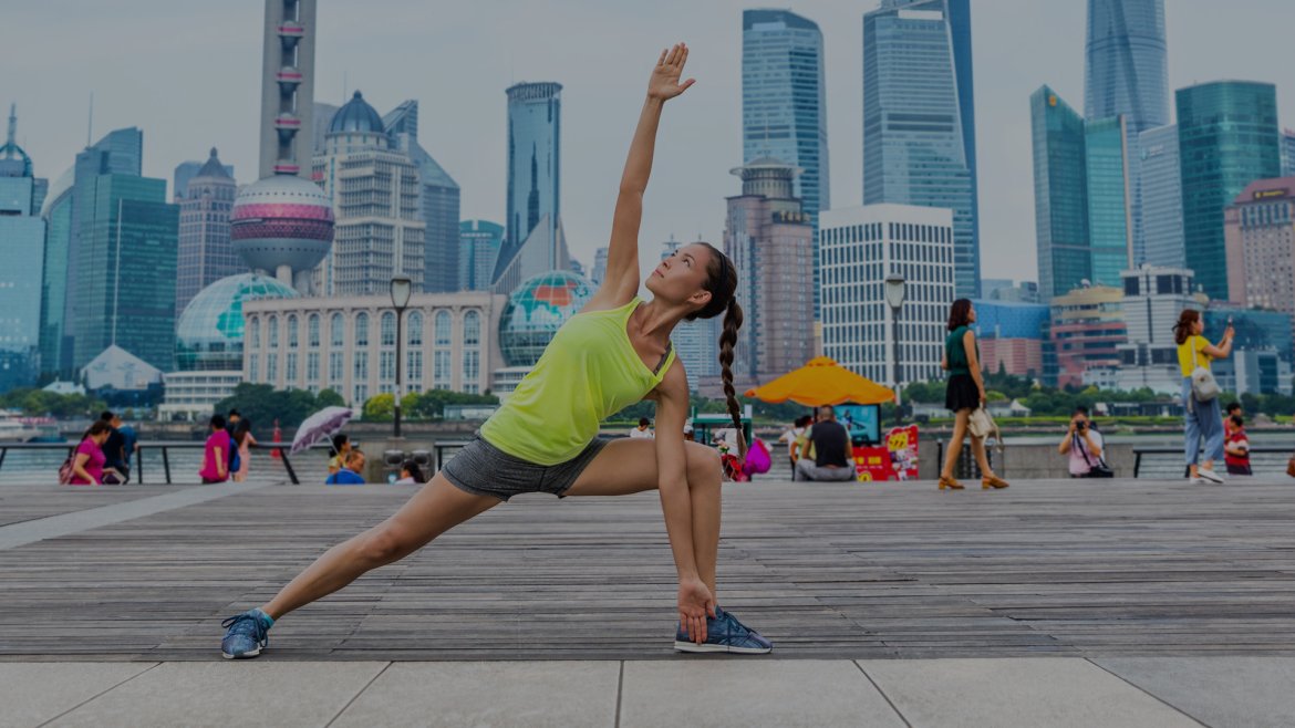 Making sports in front of skyline of Shanghai