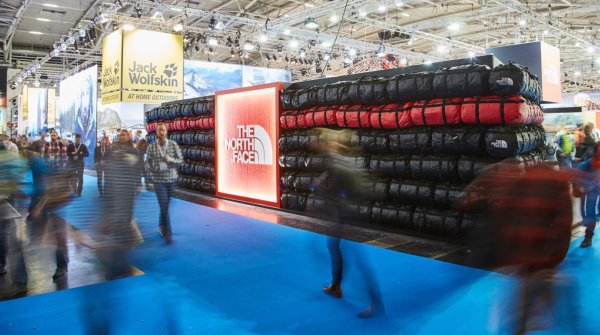 People at ISPO in front of The North Face booth. 