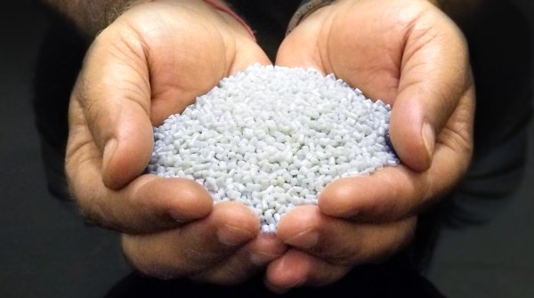 Pellets are produced from plastic collected from the oceans prior to being extruded as yarn.