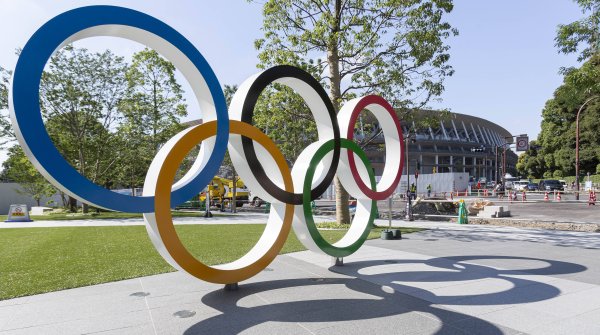 The Olympic rings in front of the new National Stadium in Tokyo - one of the sports venues of the Olympic Games.