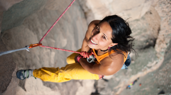 Climber Nasim Eshqi abseils down a rock face