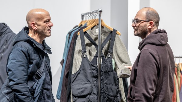 Two men talking in a retail setting