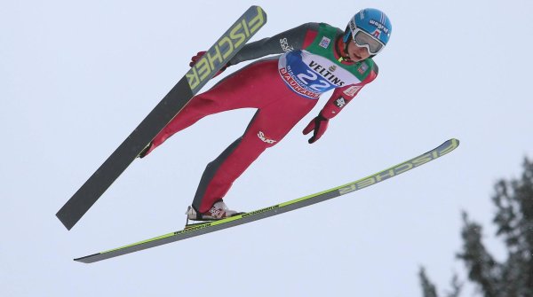Ski jumper up in the air at the Four Hills Tournament