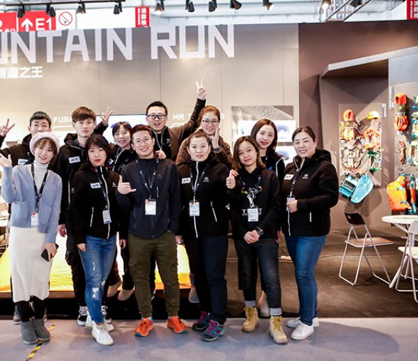 Team in front of company booth